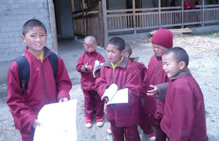 young monks going to school